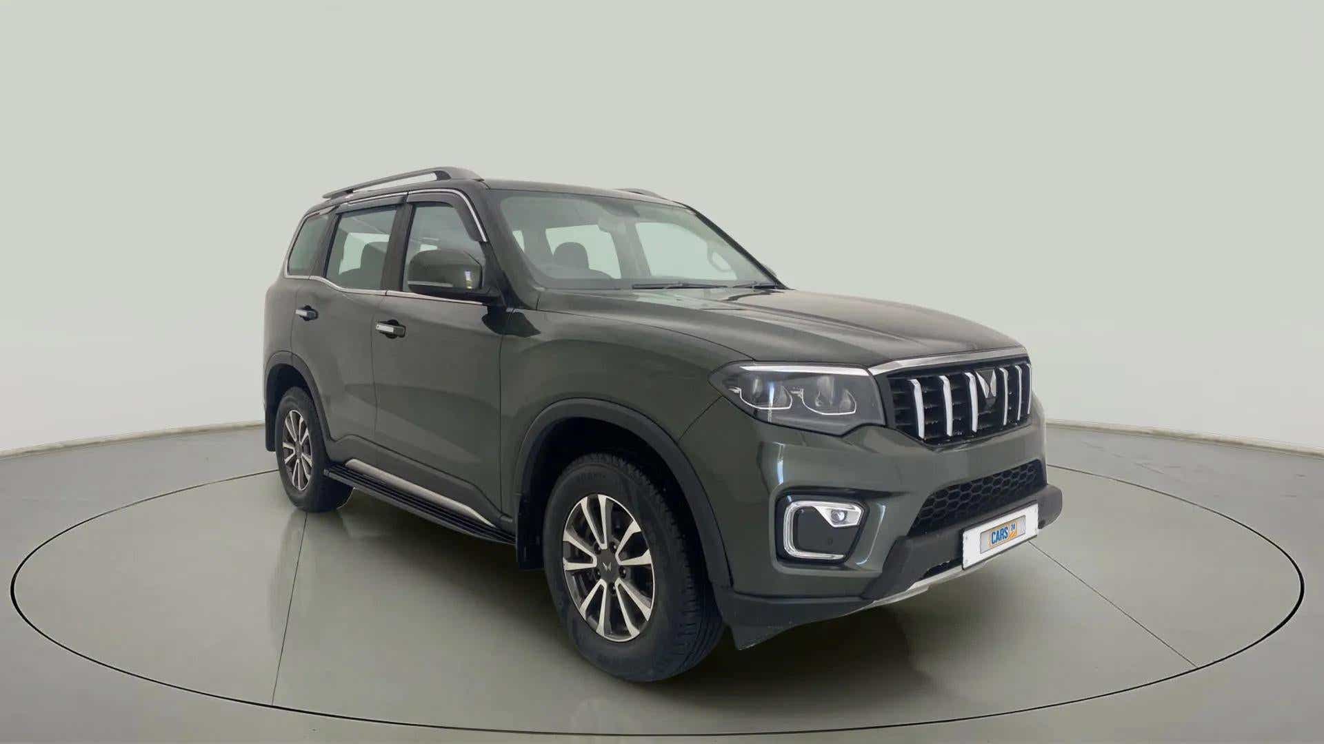 Front three-quarter view of a deep forest Mahindra Scorpio-N