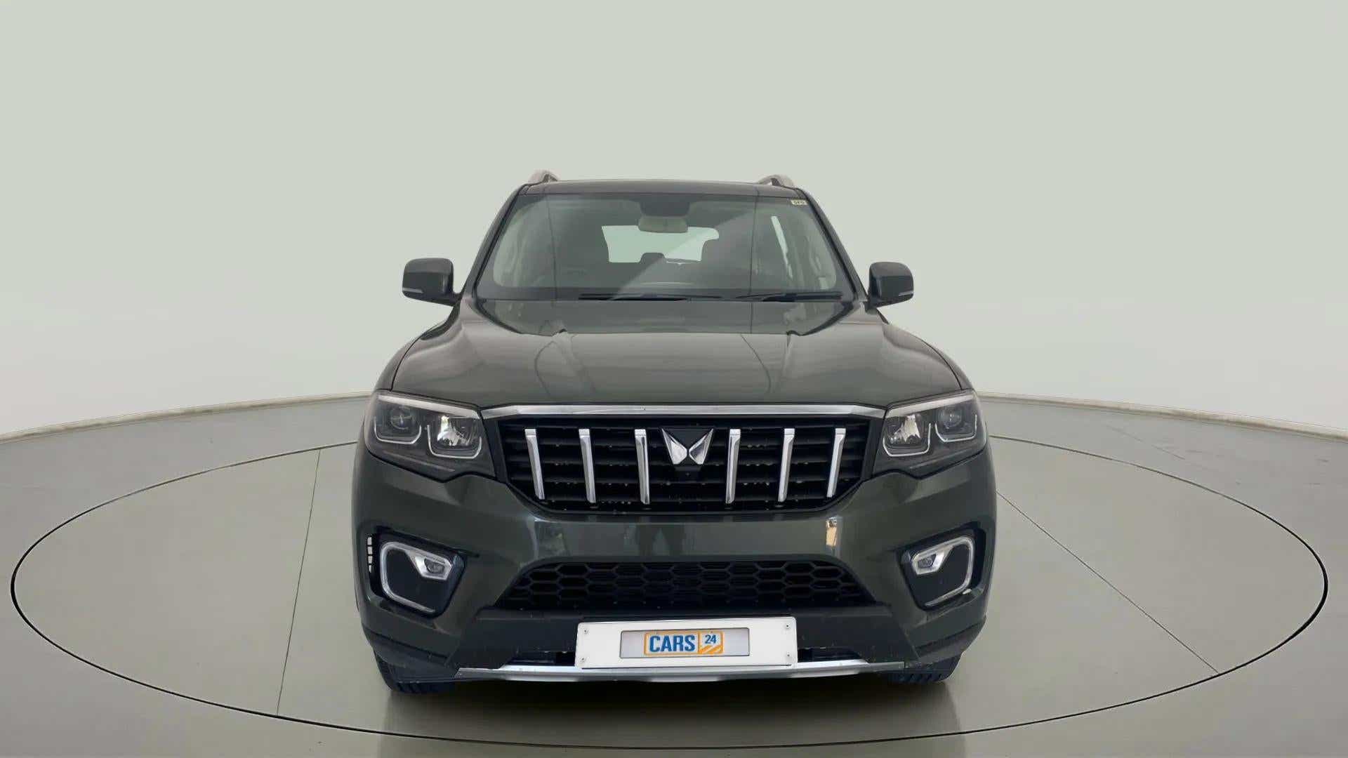 Front view of a deep forest Mahindra Scorpio-N