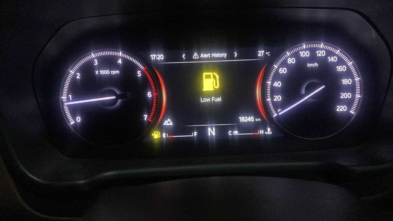 Instrument cluster of a Mahindra Scorpio-N displaying alert history and low fuel warning