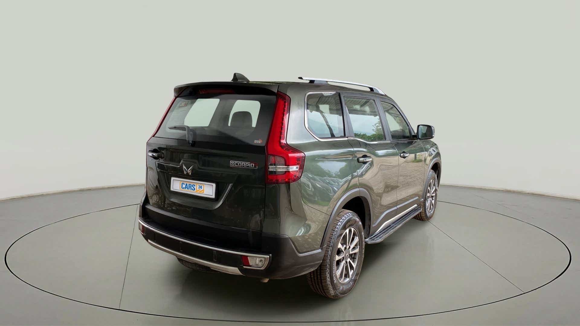 Rear three-quarter view of a deep forest Mahindra Scorpio-N