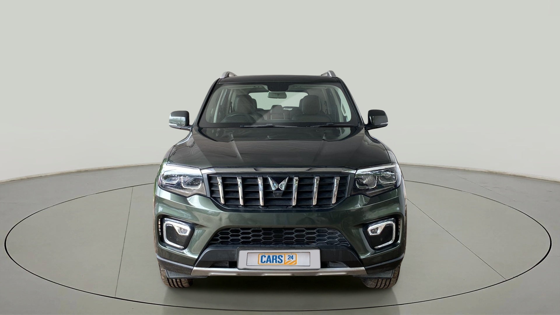 Front view of a deep forest Mahindra Scorpio-N