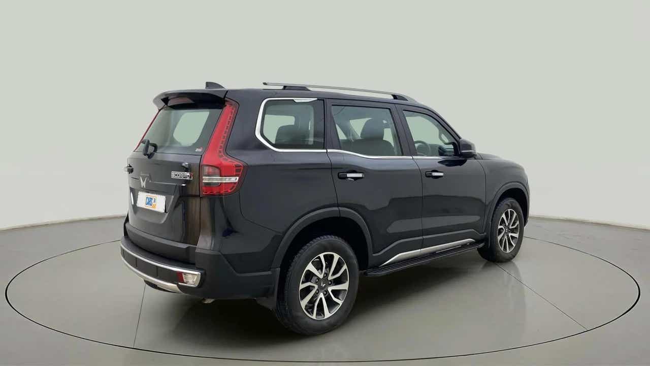 Rear three-quarter view of a deep forest Mahindra Scorpio-N