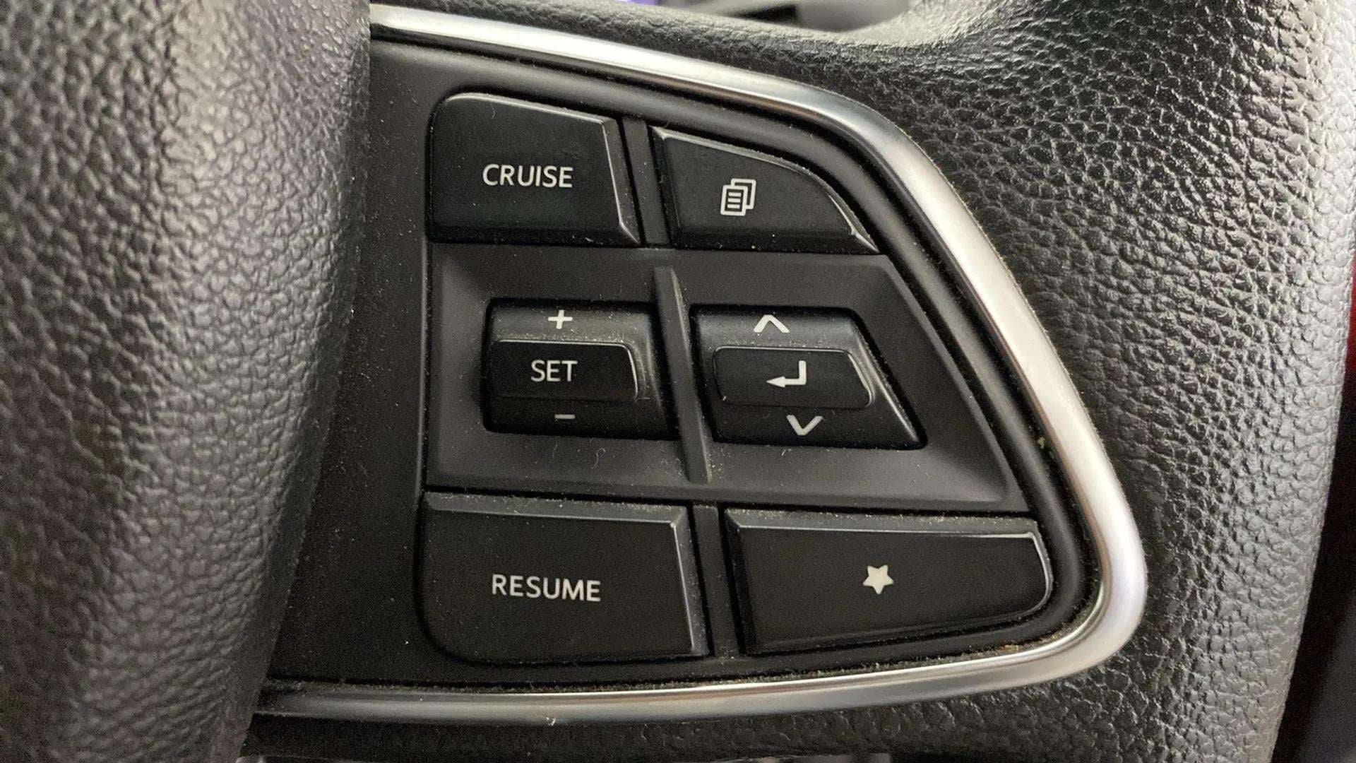 Steering wheel cruise control buttons of a Mahindra Scorpio-N
