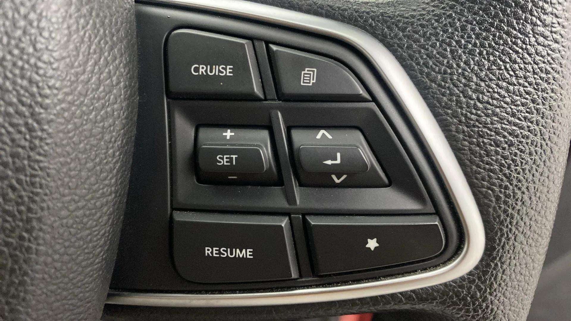 Steering wheel cruise control buttons of a Mahindra Scorpio-N