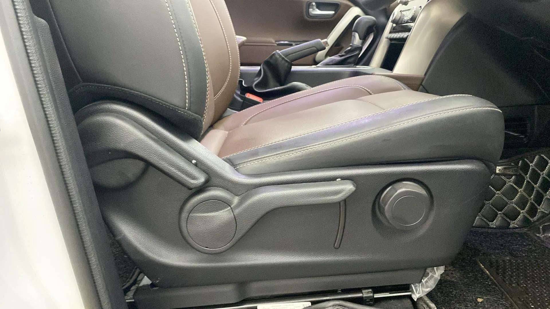 Front seat controls and side view of a Mahindra Scorpio-N interior