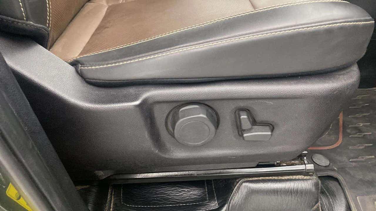 Front seat adjustment controls of a Mahindra Scorpio-N