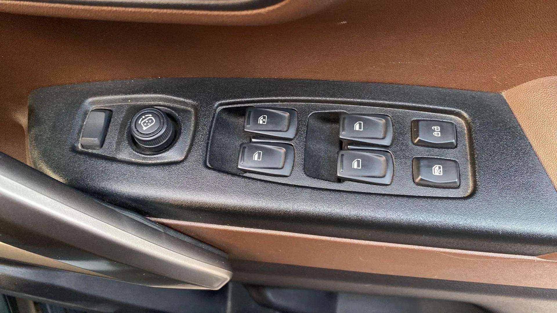 Driver side window and lock controls of a Mahindra Scorpio-N