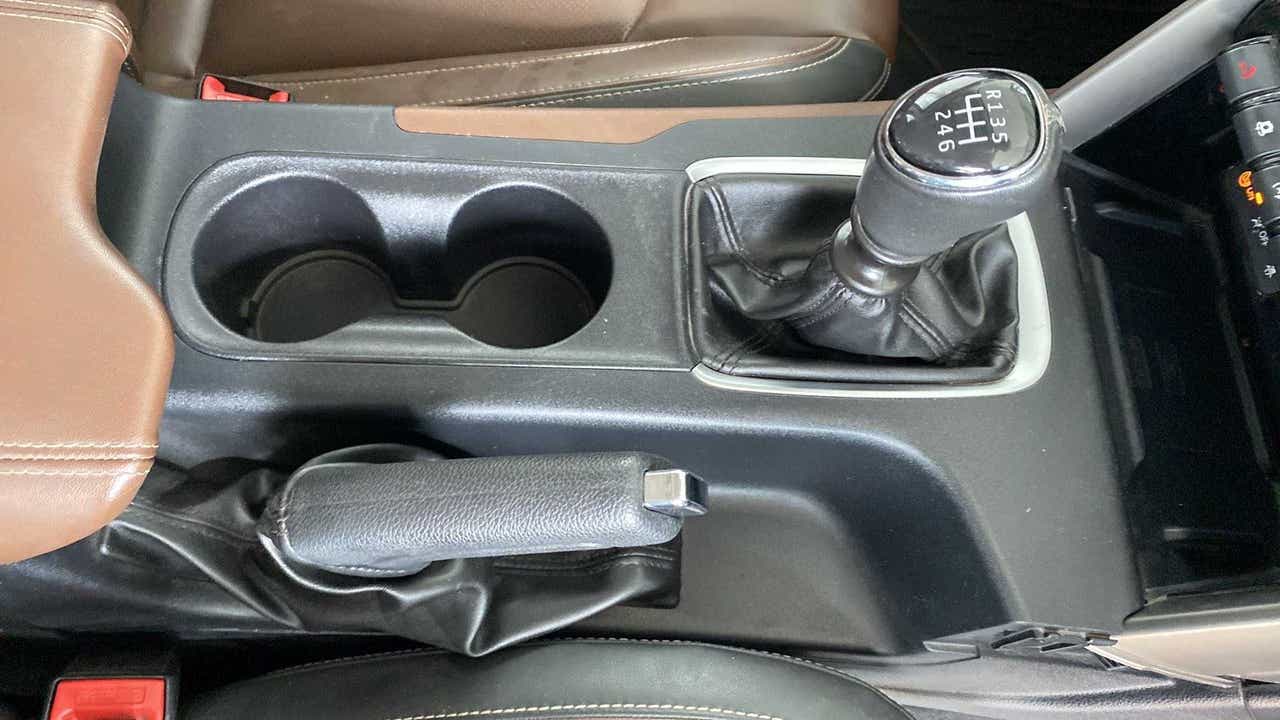 Gear shifter and handbrake view of a Mahindra Scorpio-N