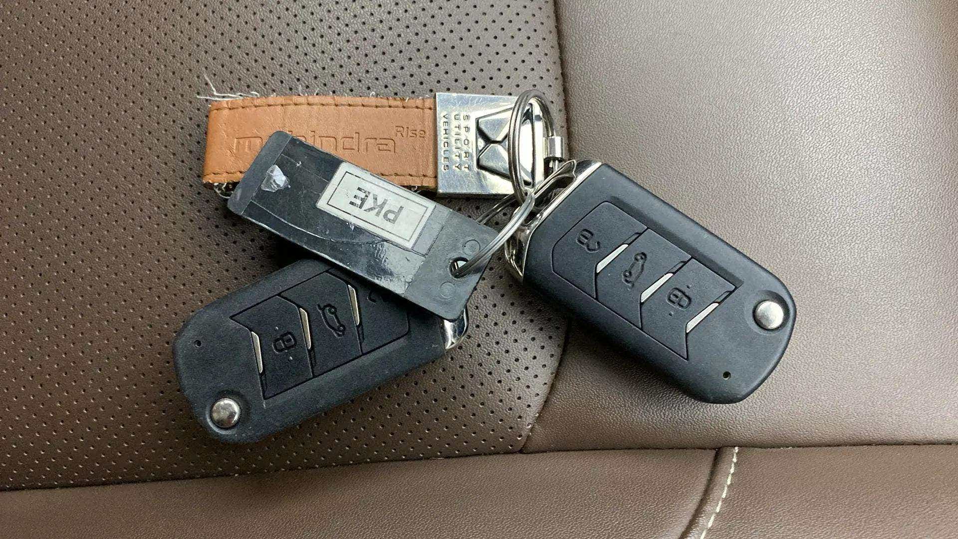 Car key fobs on leather seat of a Mahindra Scorpio-N