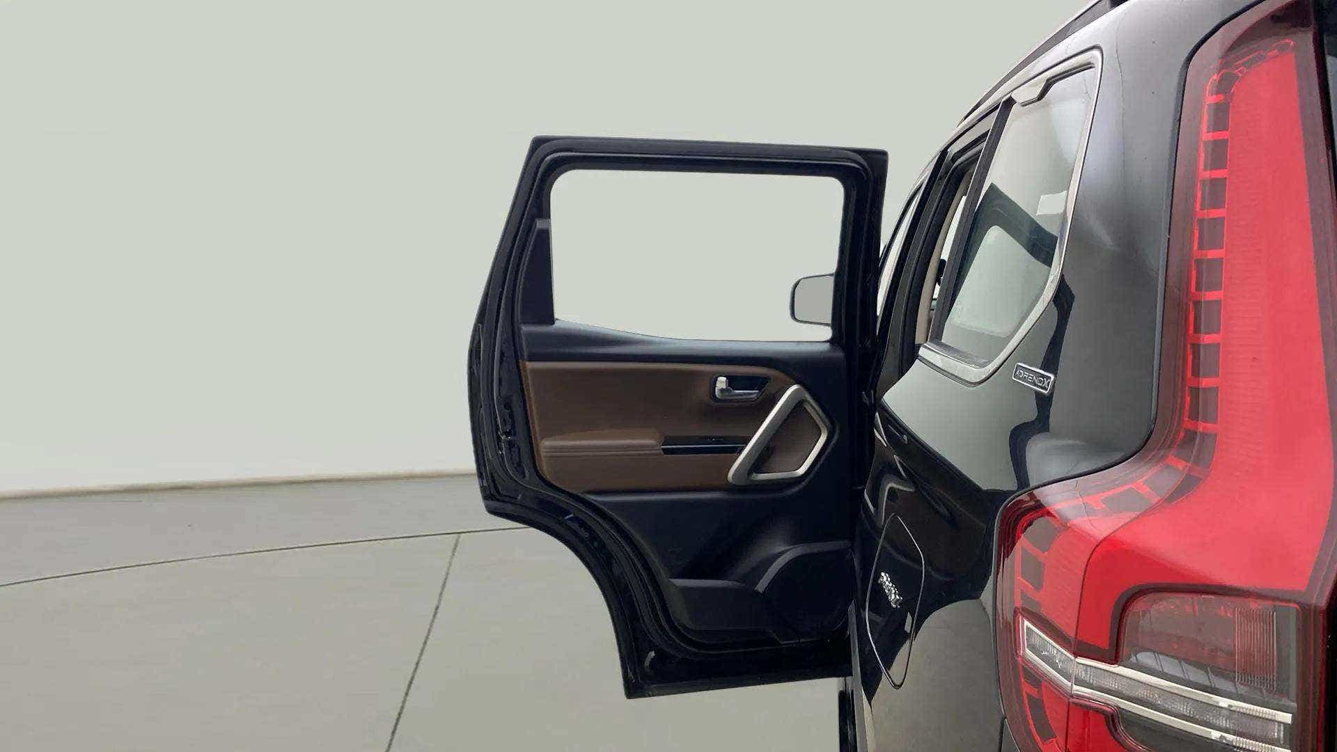 Rear door and taillight view of a Mahindra Scorpio-N
