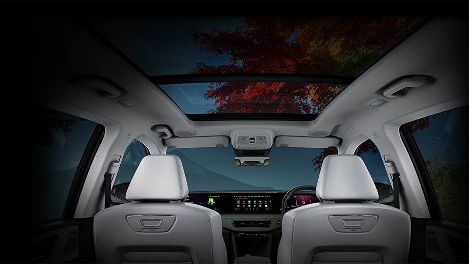 Interior dashboard and panoramic sunroof view of a Mahindra XEV 9S