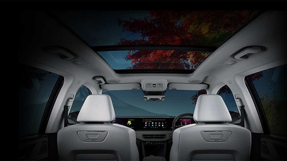 Interior dashboard and panoramic sunroof view of a Mahindra XEV 9S