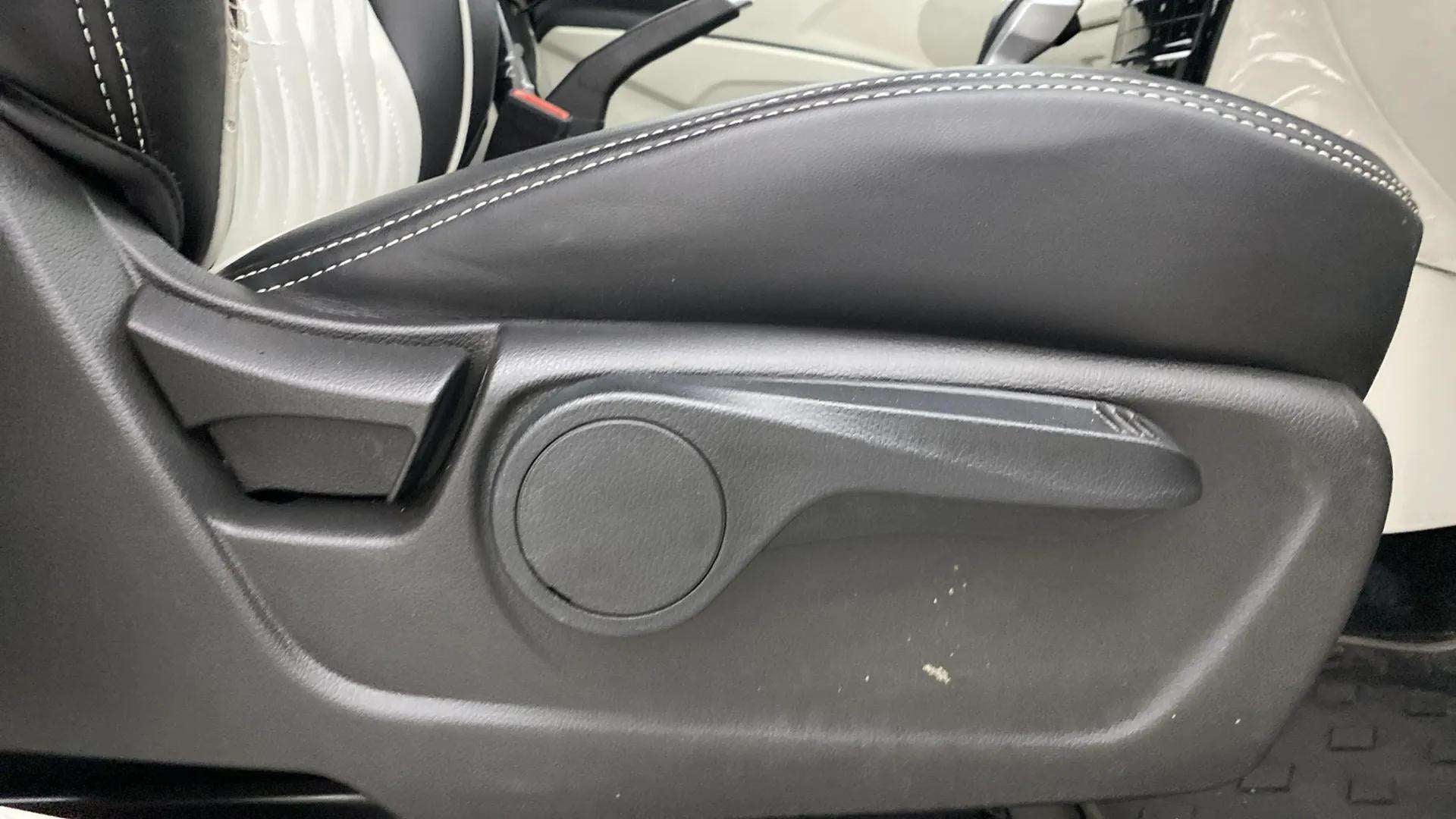 Manual seat adjustment lever close-up of a Mahindra XUV 3XO
