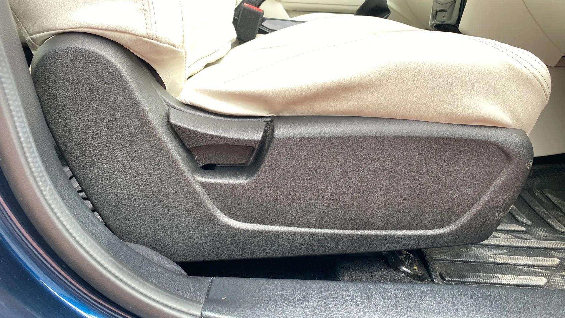 Side view of a Mahindra XUV 3XO front seat adjustment panel