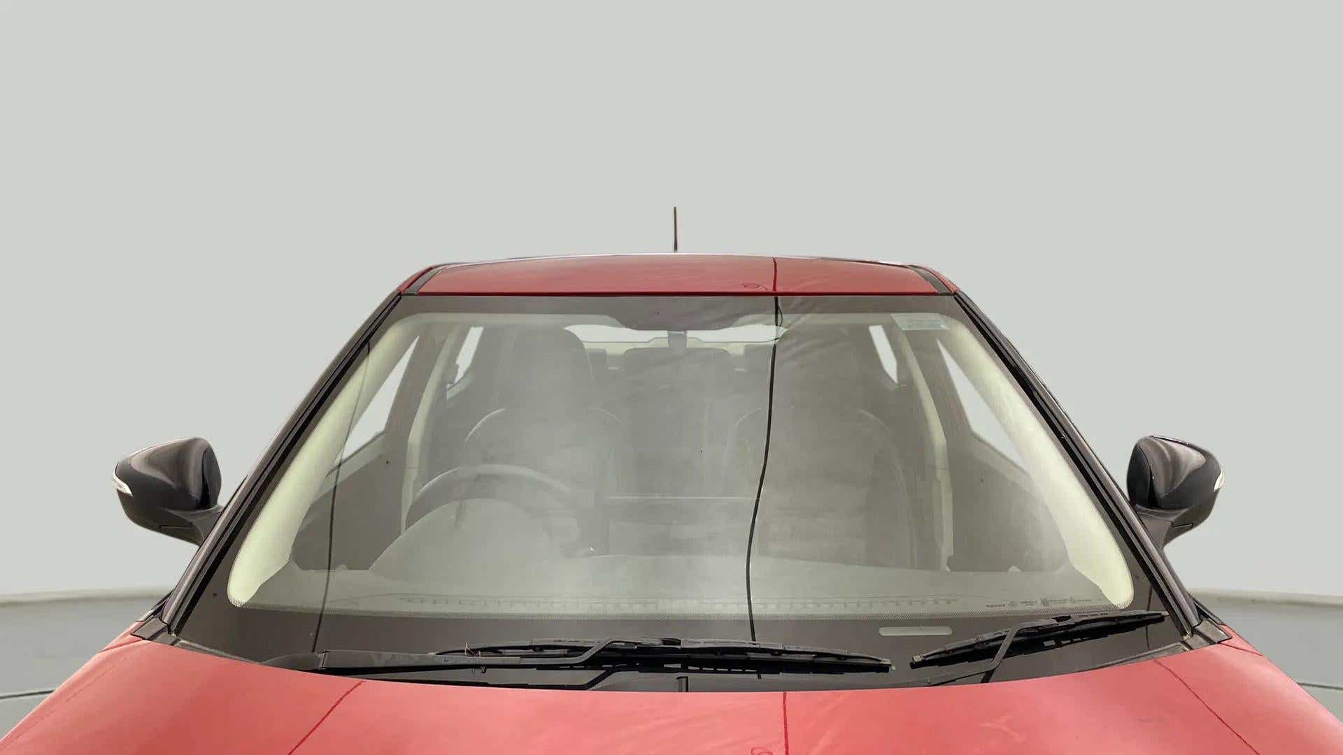 Front windshield and mirrors of a Mahindra XUV 3XO
