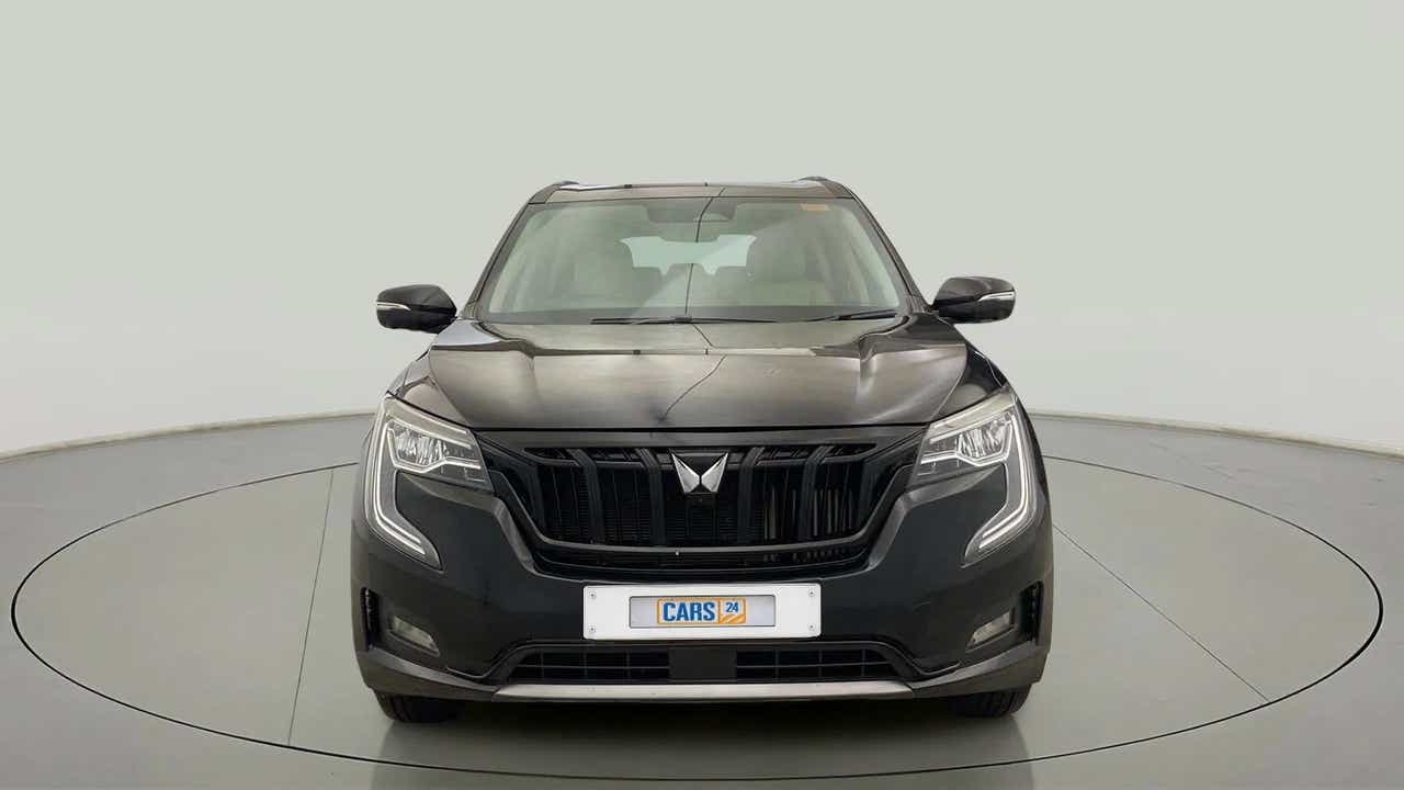 Front view of a midnight black Mahindra XUV700