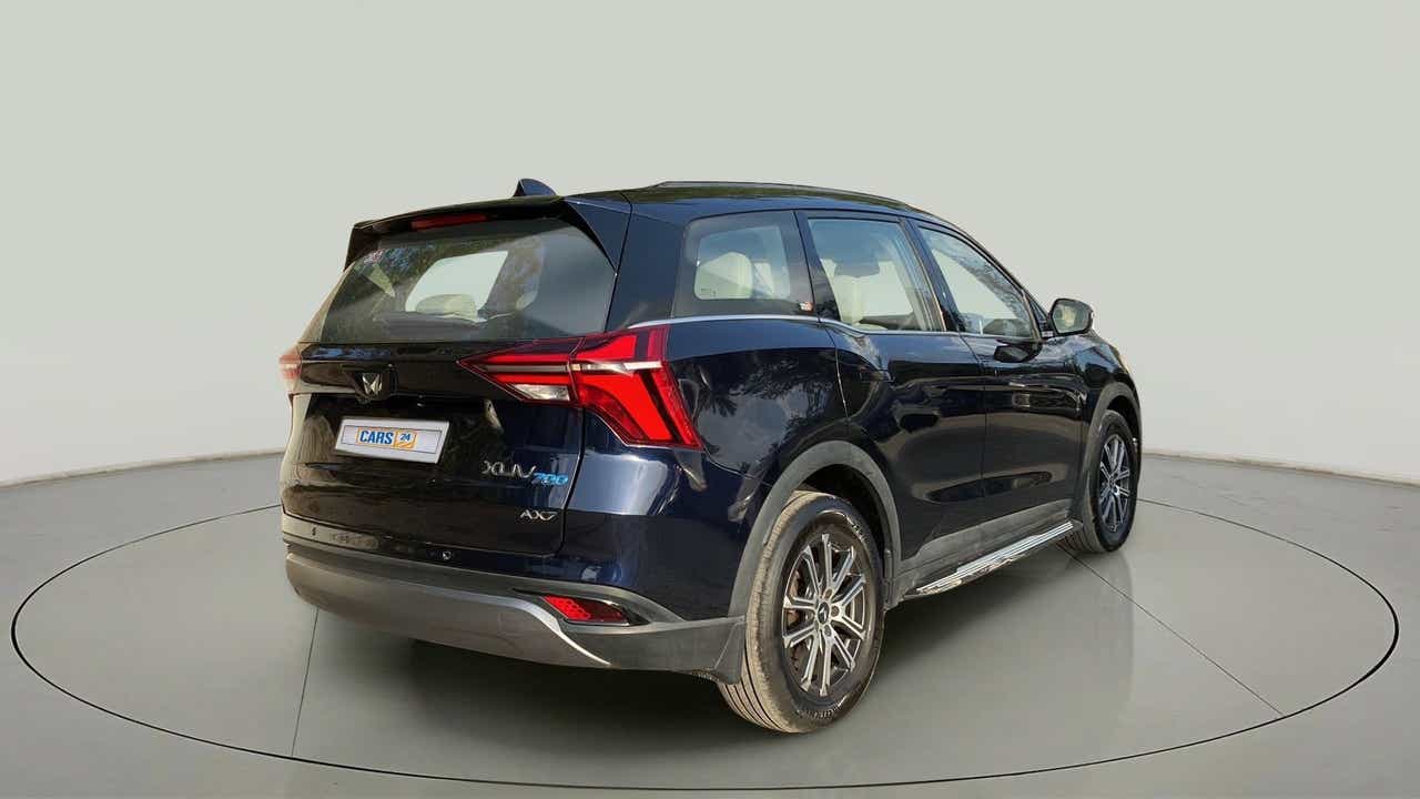 Rear three-quarter of a Mahindra XUV700 AX7