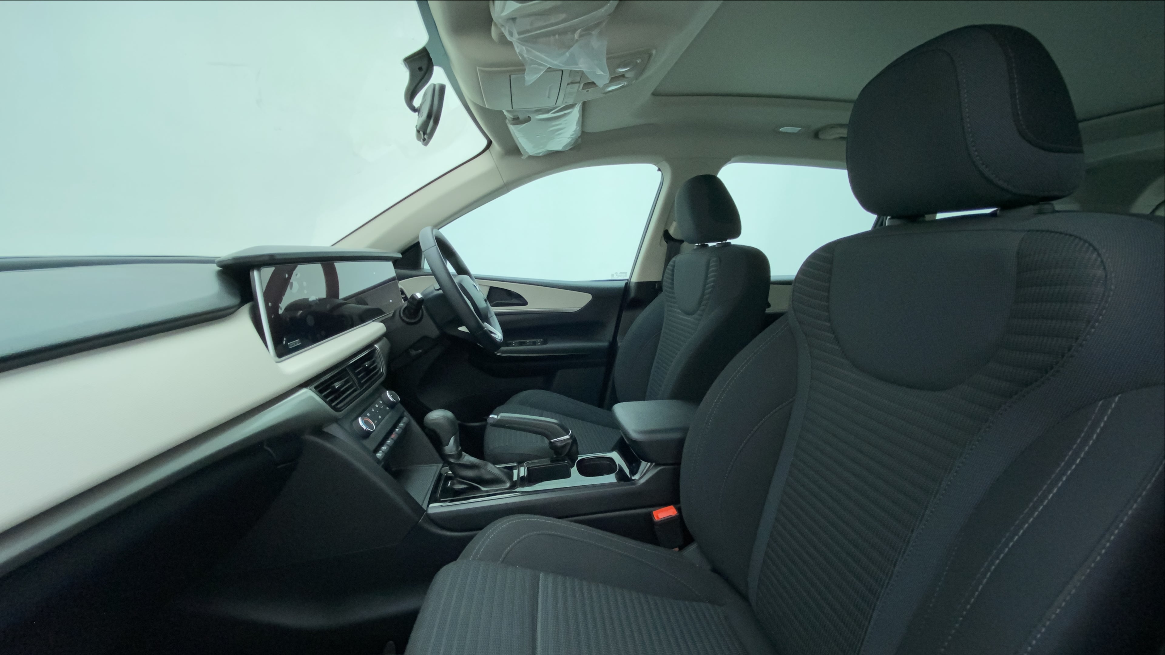 Interior front seats and dashboard of a Mahindra XUV700