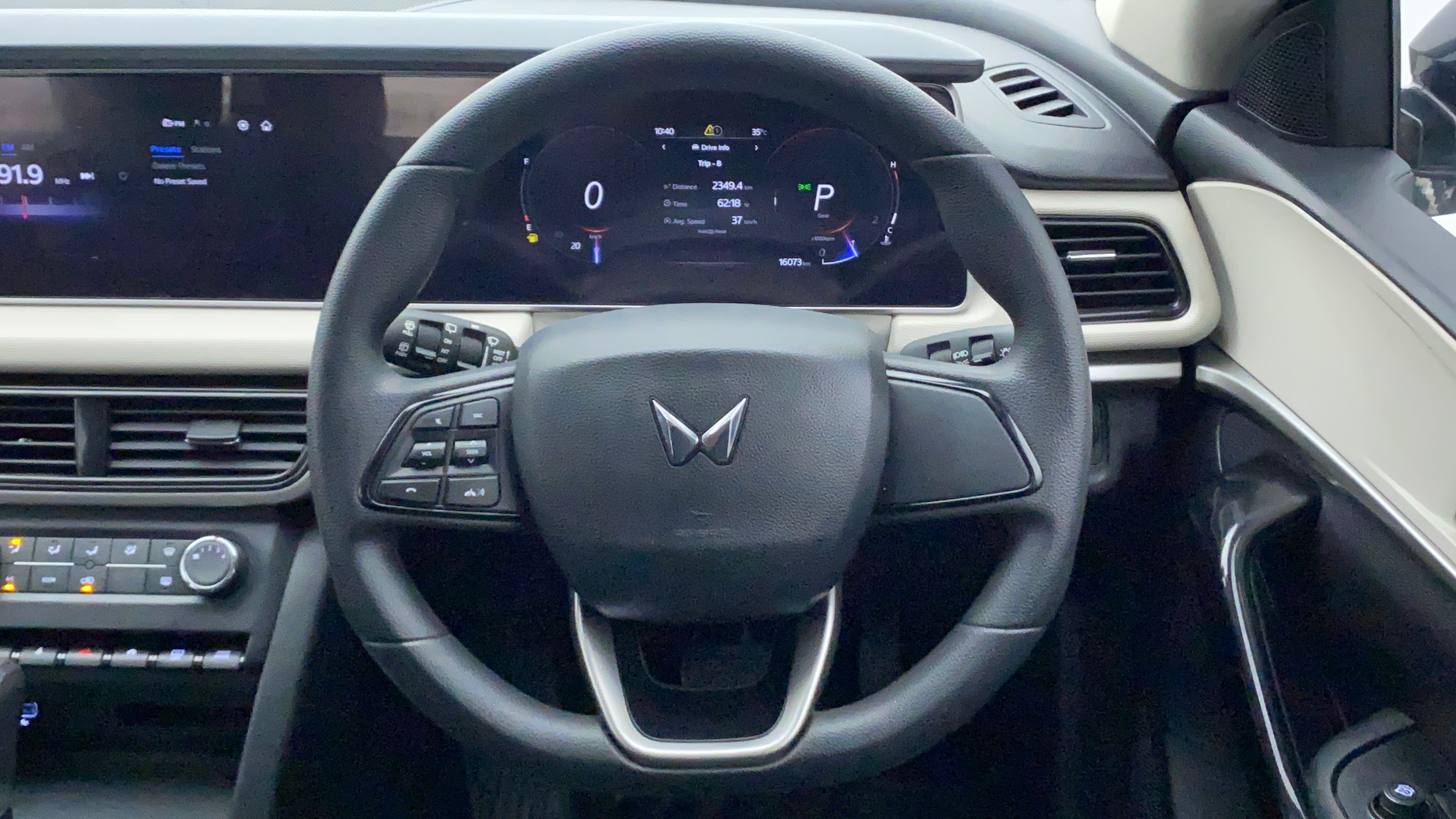 Steering wheel and dashboard view of a Mahindra XUV700
