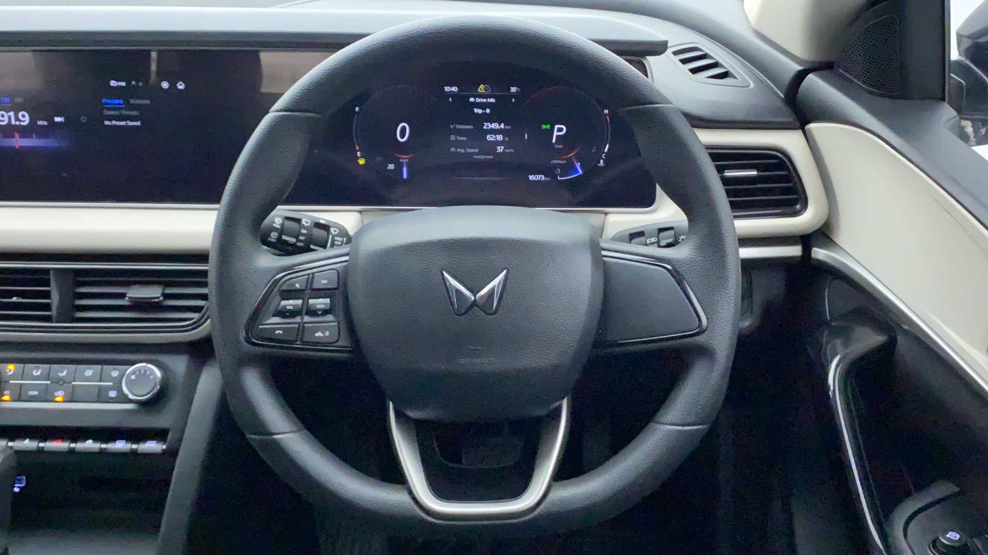 Steering wheel and dashboard view of a Mahindra XUV700