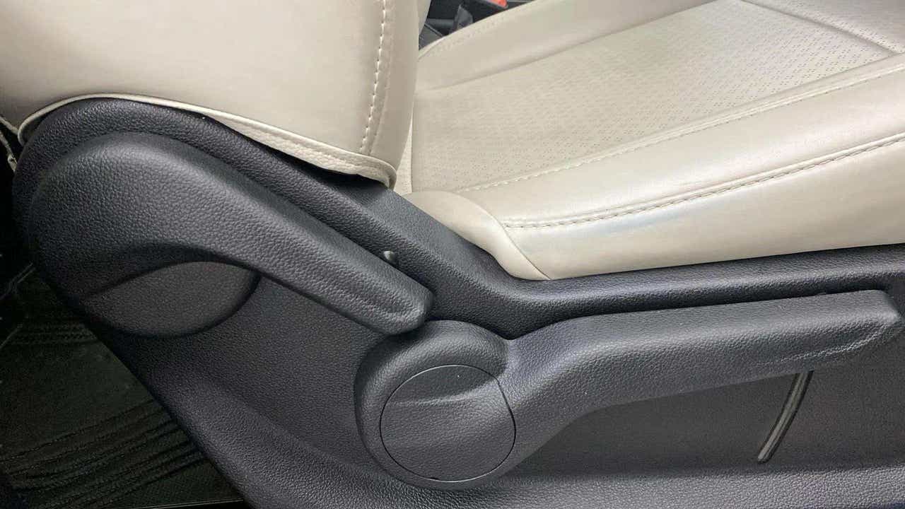 Side view of front seat adjuster of a Mahindra XUV700