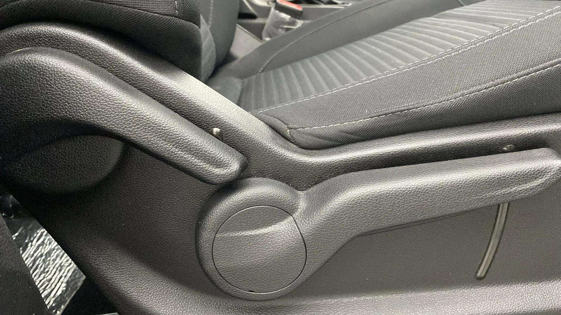 Close-up of seat adjustment lever of a Mahindra XUV700