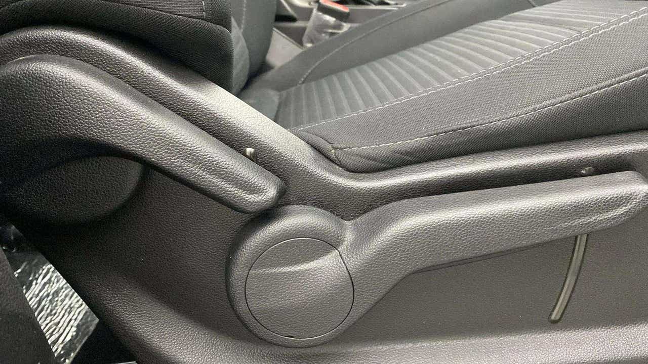Close-up of seat adjustment lever of a Mahindra XUV700