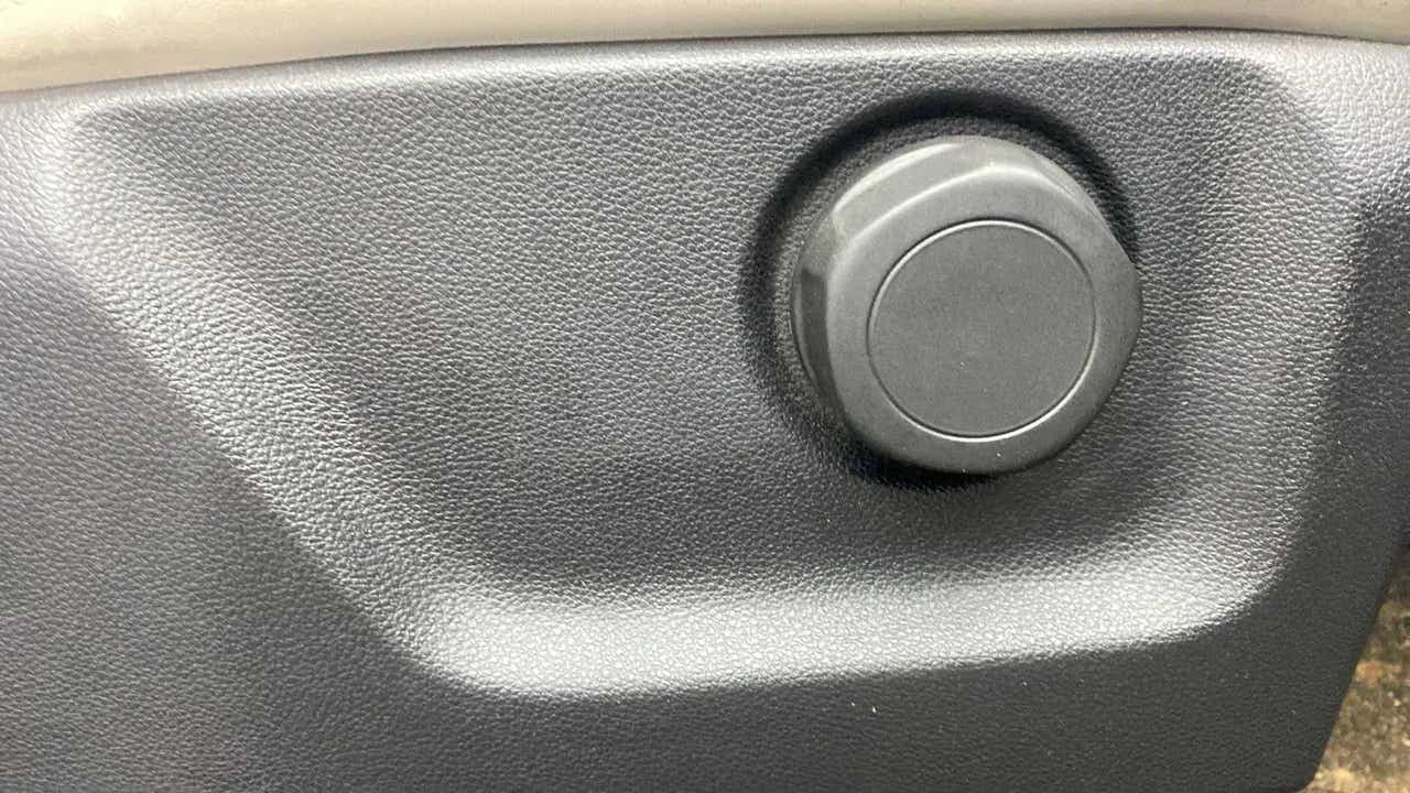 Close up of a seat adjustment knob of a Mahindra XUV700