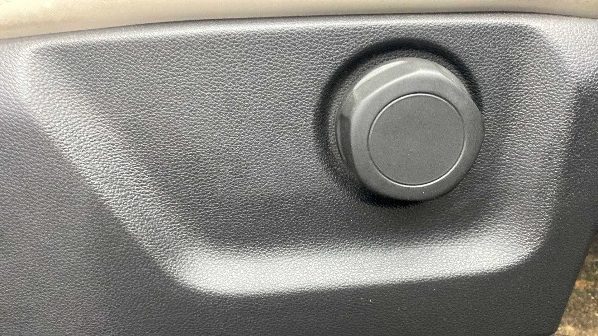Close up of a seat adjustment knob of a Mahindra XUV700