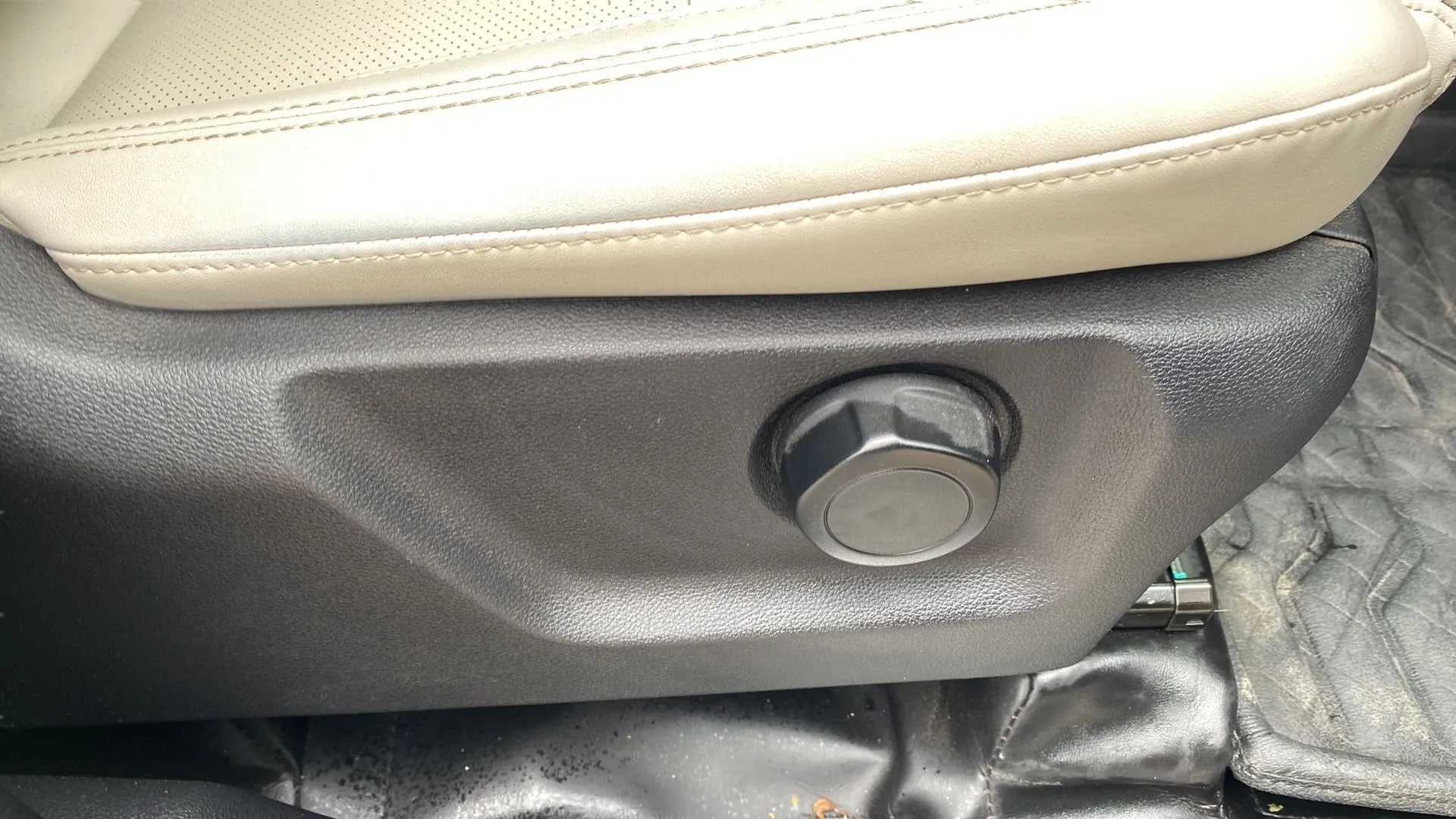 Seat adjustment knob close-up of a Mahindra XUV700