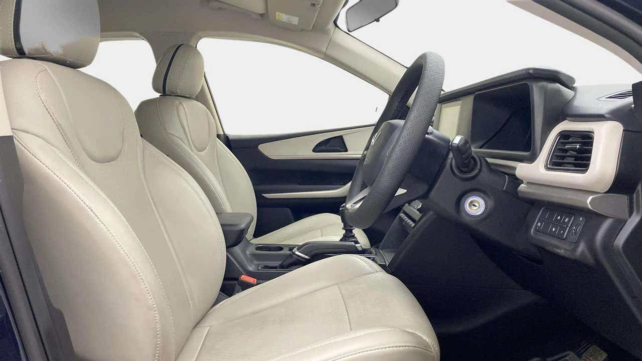 Front seat and dashboard view of a Mahindra XUV700
