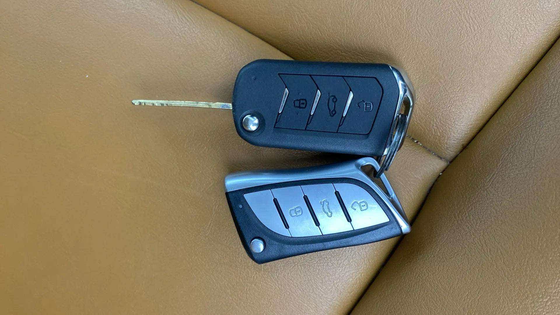 Car key fobs on a seat of a Mahindra XUV700