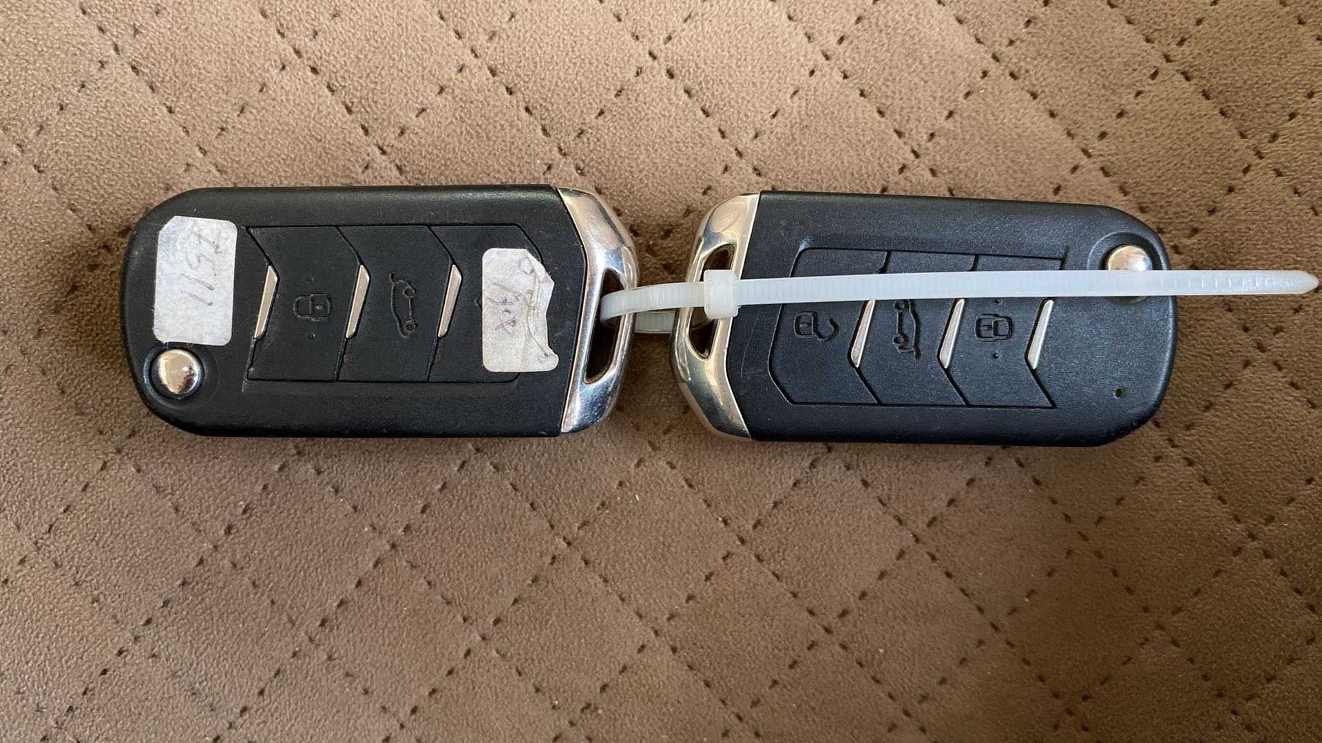 Close-up of a Mahindra XUV700 key fob set