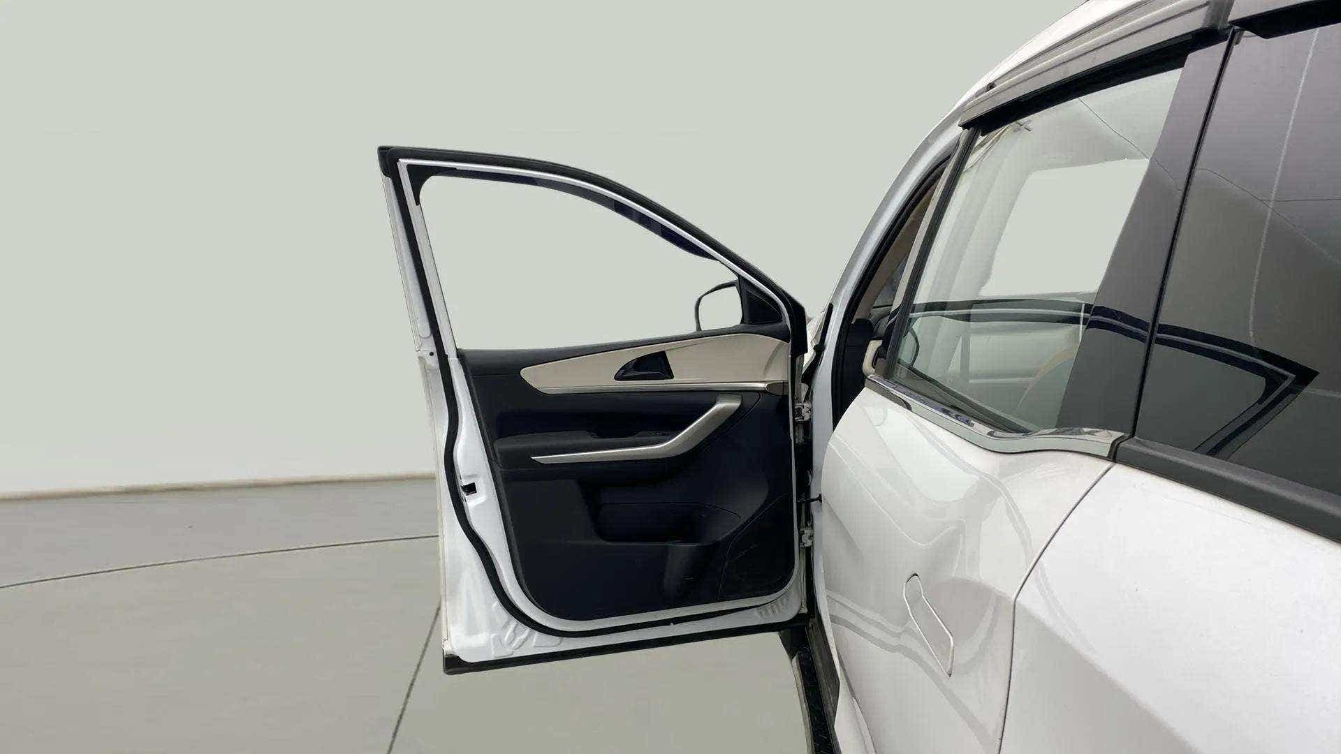 Front driver side door open view of a Mahindra XUV700