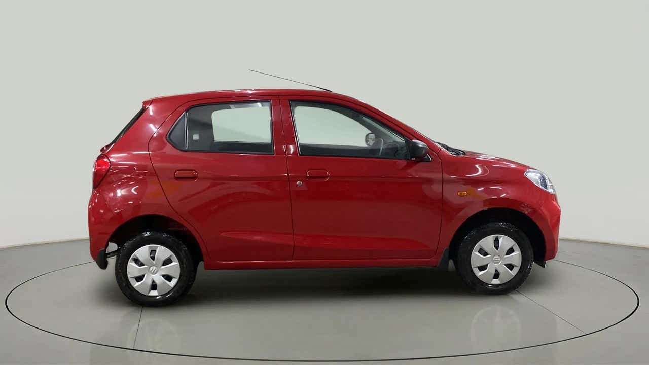 Side view of a Metallic Sizzling Red Maruti Suzuki Alto K10