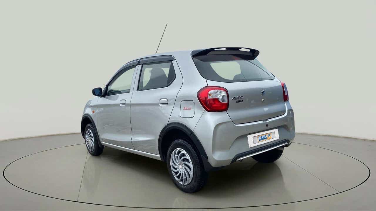 Rear three-quarter of a metallic-silky-silver Maruti Suzuki Alto K10