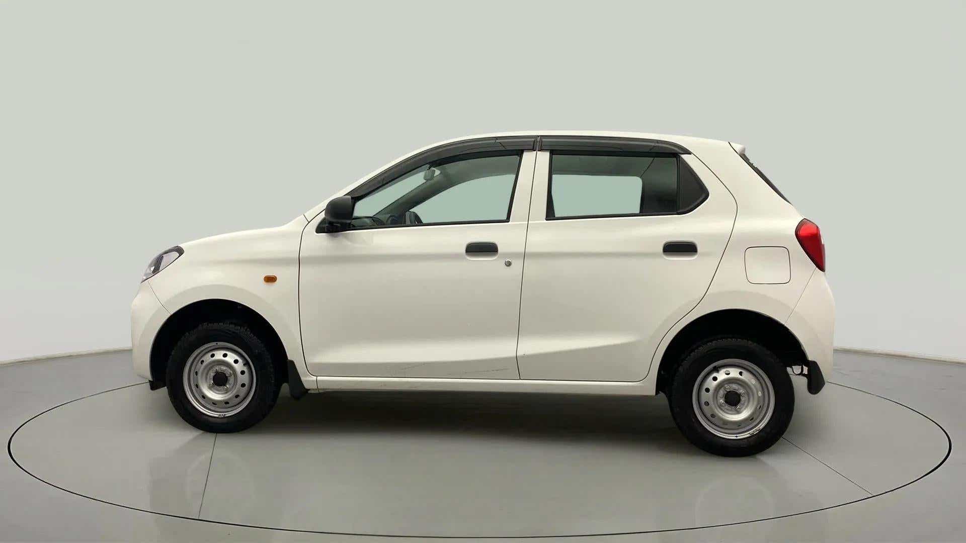 Side view of a metallic solid white Maruti Suzuki Alto K10