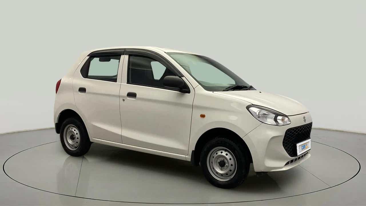 Front side view of a metallic solid white Maruti Suzuki Alto K10