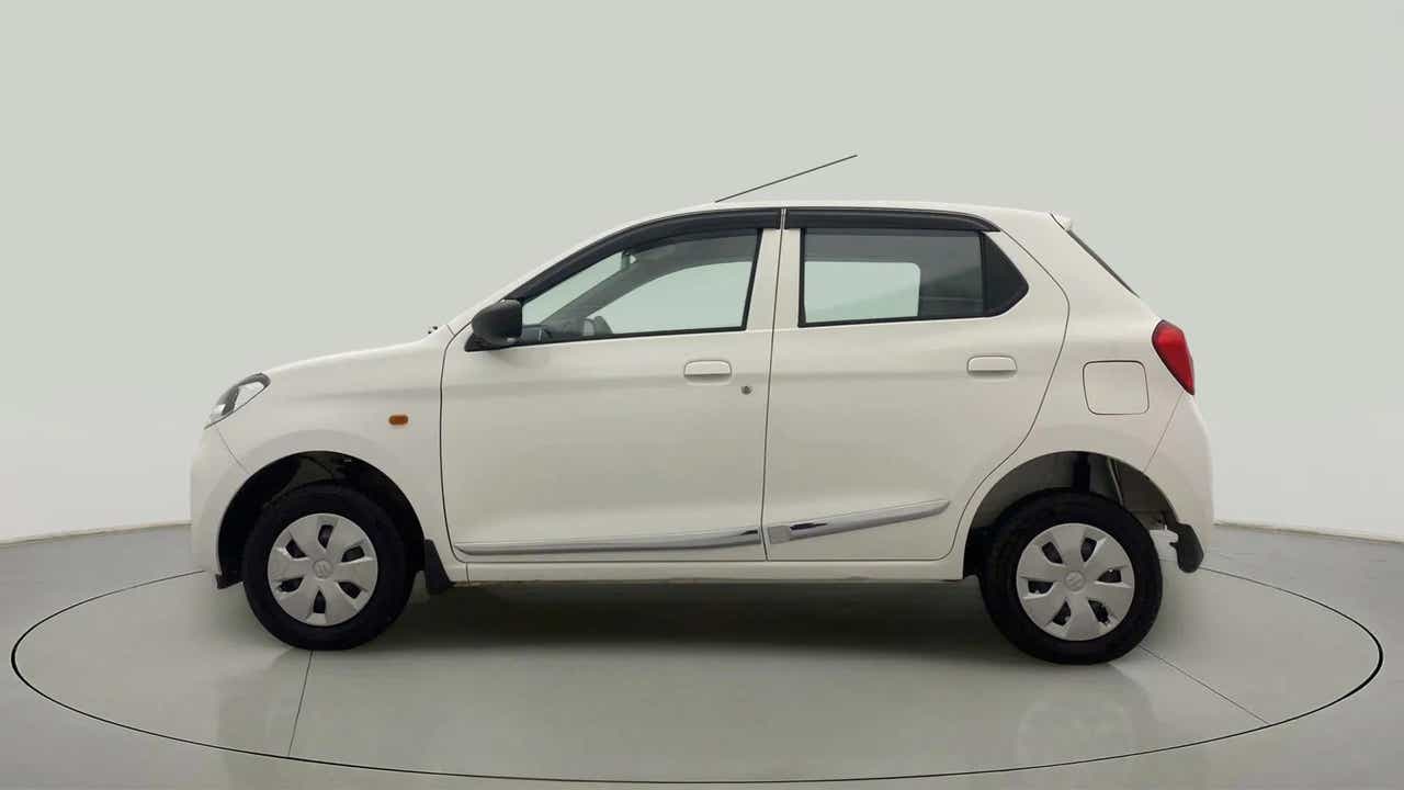 Side view of a metallic solid white Maruti Suzuki Alto K10