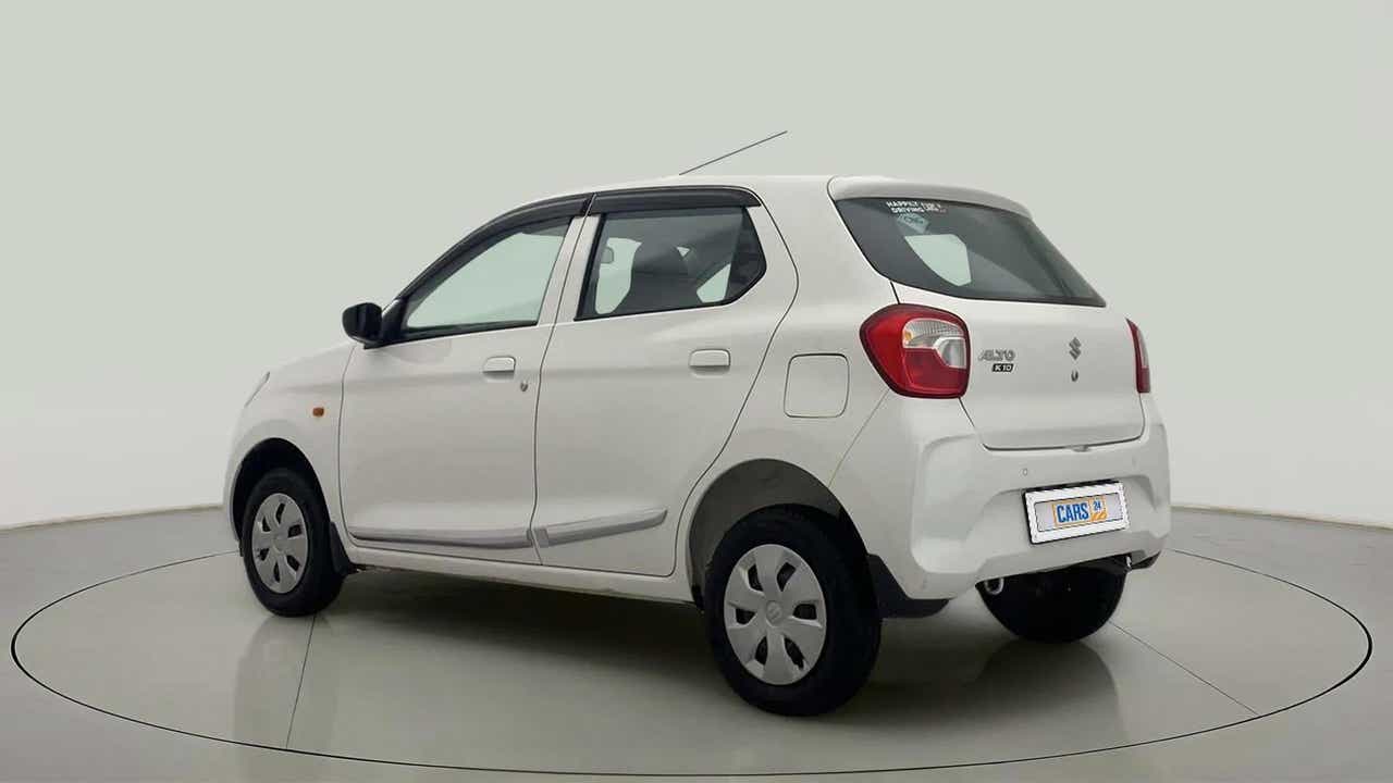 Rear three-quarter view of a metallic solid white Maruti Suzuki Alto K10