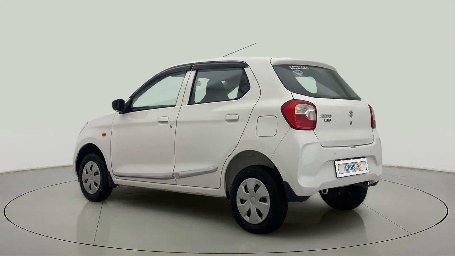 Rear three-quarter view of a metallic solid white Maruti Suzuki Alto K10