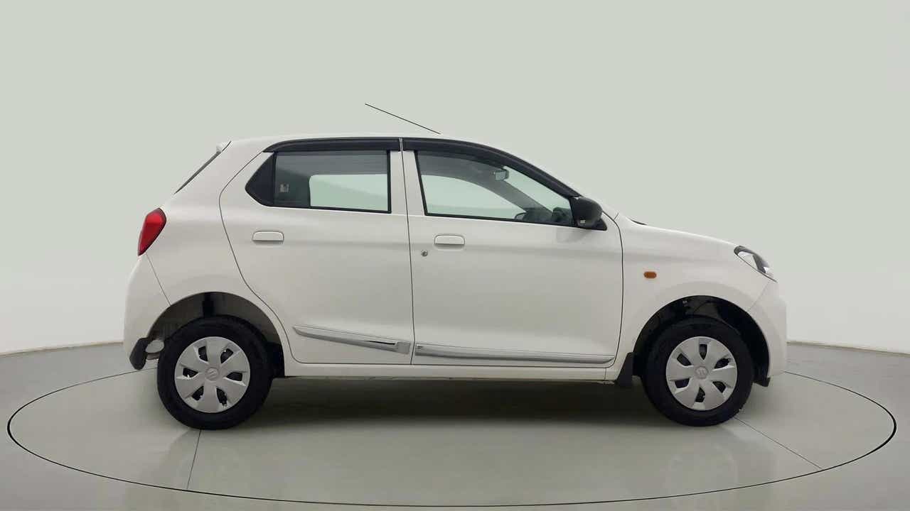 Side view of a metallic solid white Maruti Suzuki Alto K10