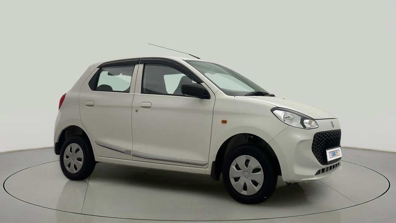 Front side view of a metallic solid white Maruti Suzuki Alto K10