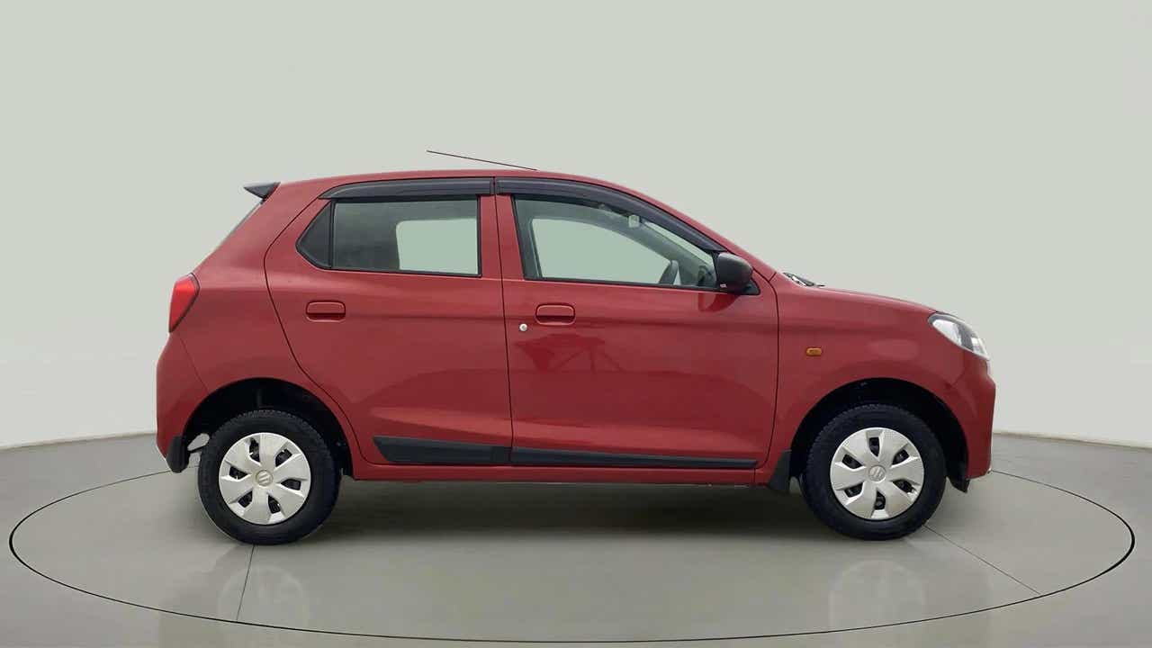 Side view of a Metallic Sizzling Red Maruti Suzuki Alto K10