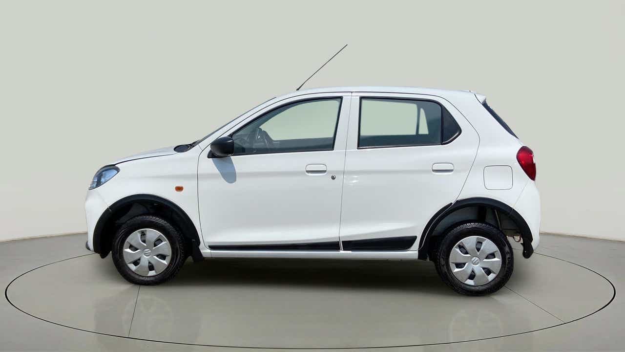 Side view of a metallic solid white Maruti Suzuki Alto K10
