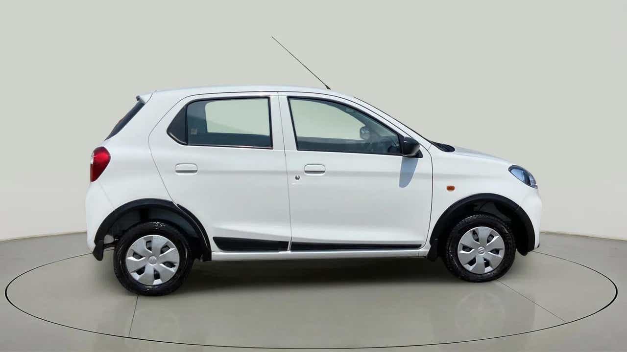 Side view of a metallic solid white Maruti Suzuki Alto K10