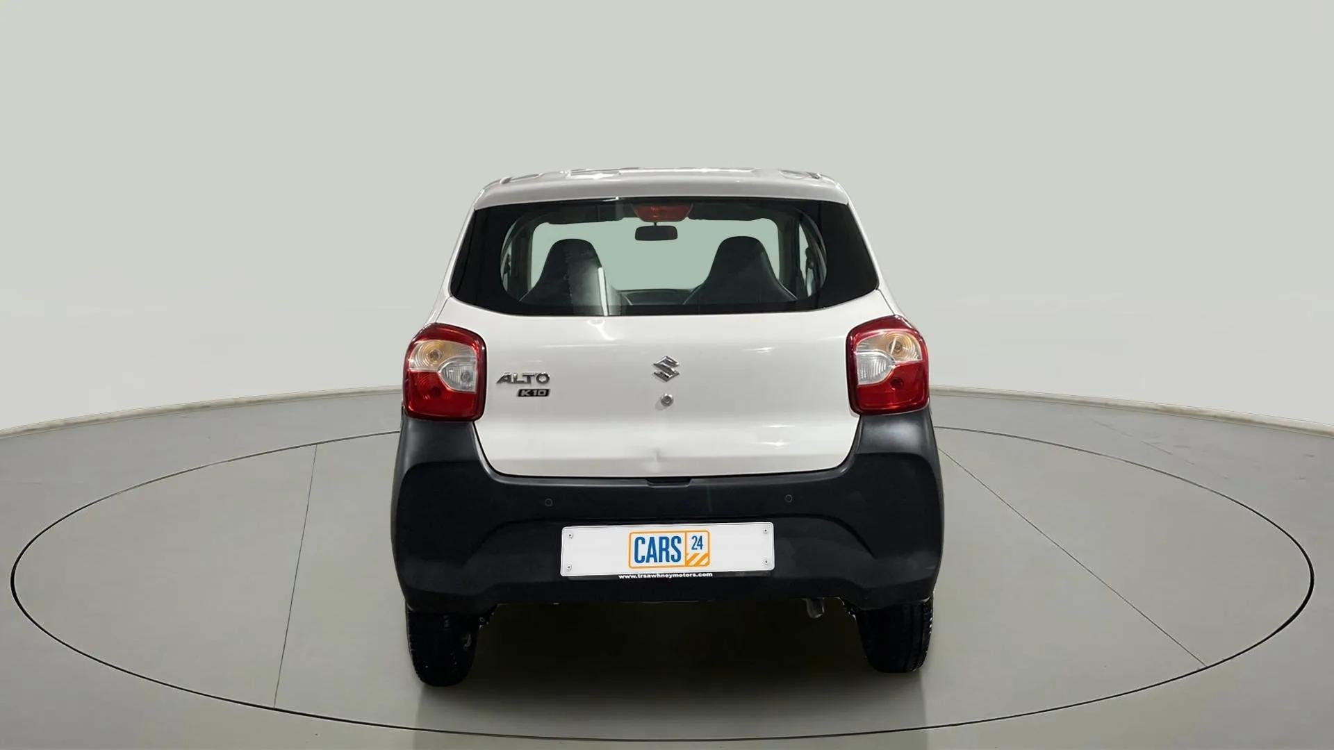 Rear view of a metallic solid white Maruti Suzuki Alto K10