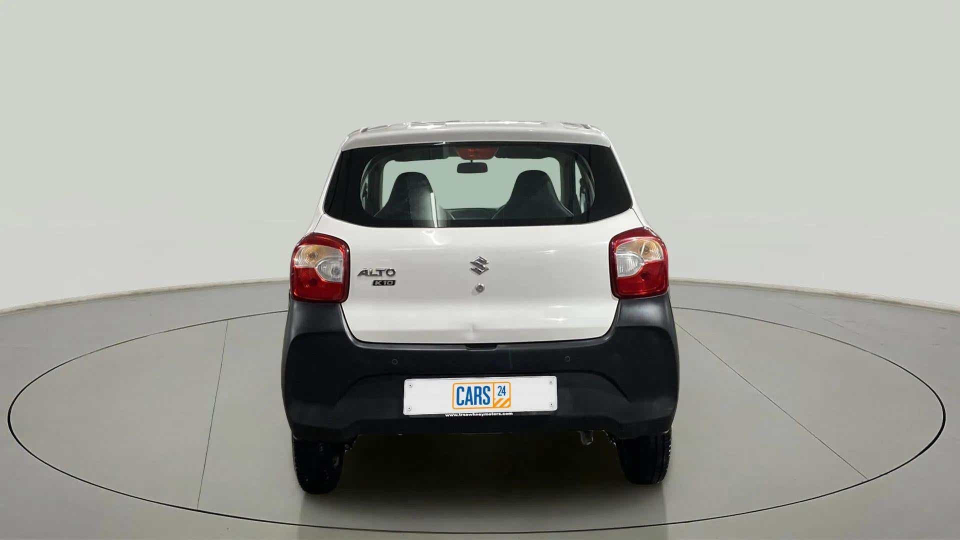 Rear view of a metallic solid white Maruti Suzuki Alto K10
