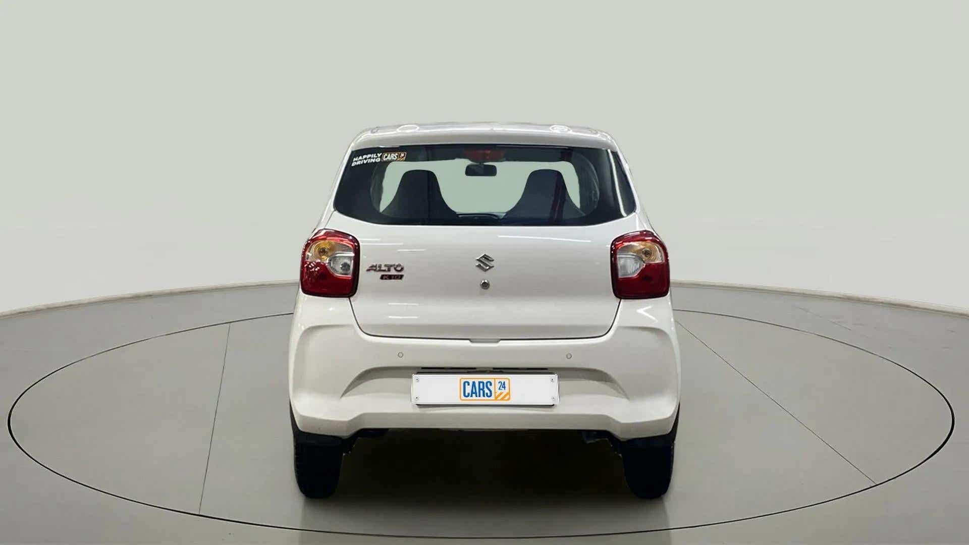 Rear view of a metallic solid white Maruti Suzuki Alto K10