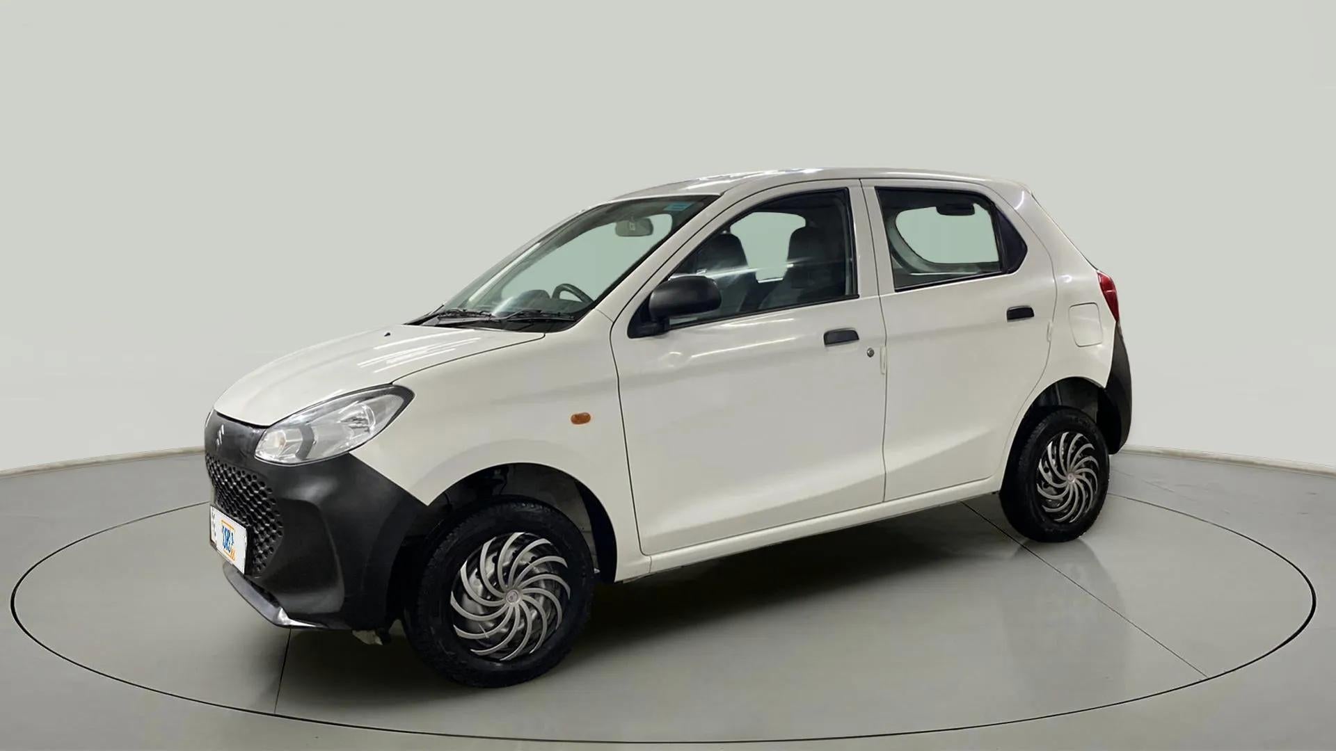 Front side view of a metallic solid white Maruti Suzuki Alto K10